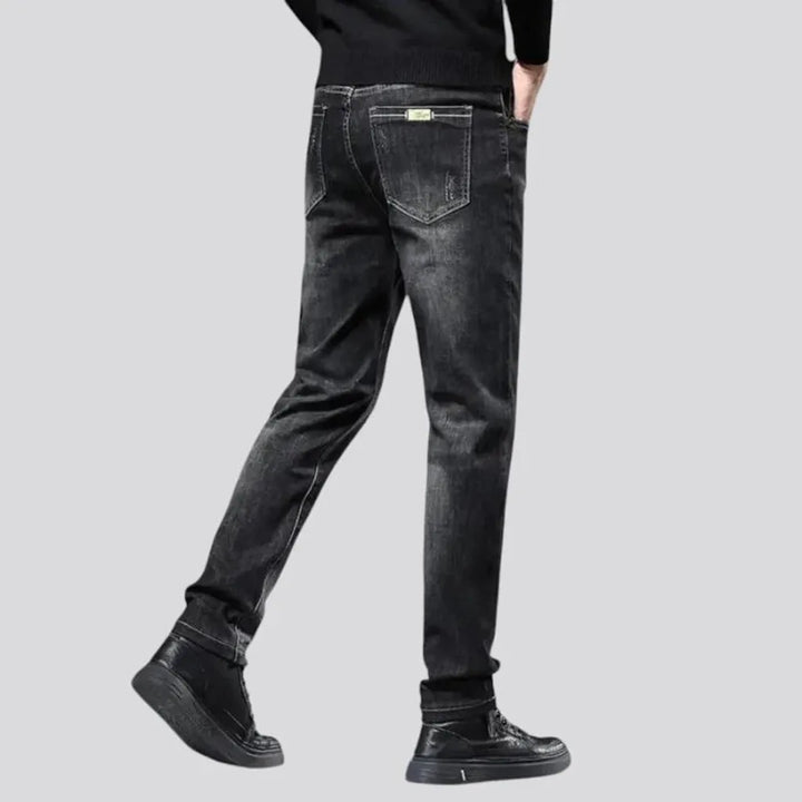 Elastic dark padded jeans for men