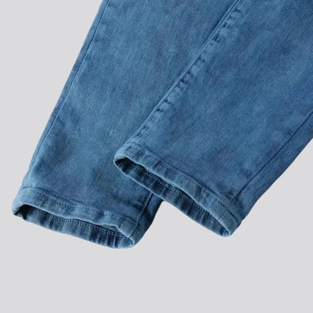 Distressed mid rise men's jeans