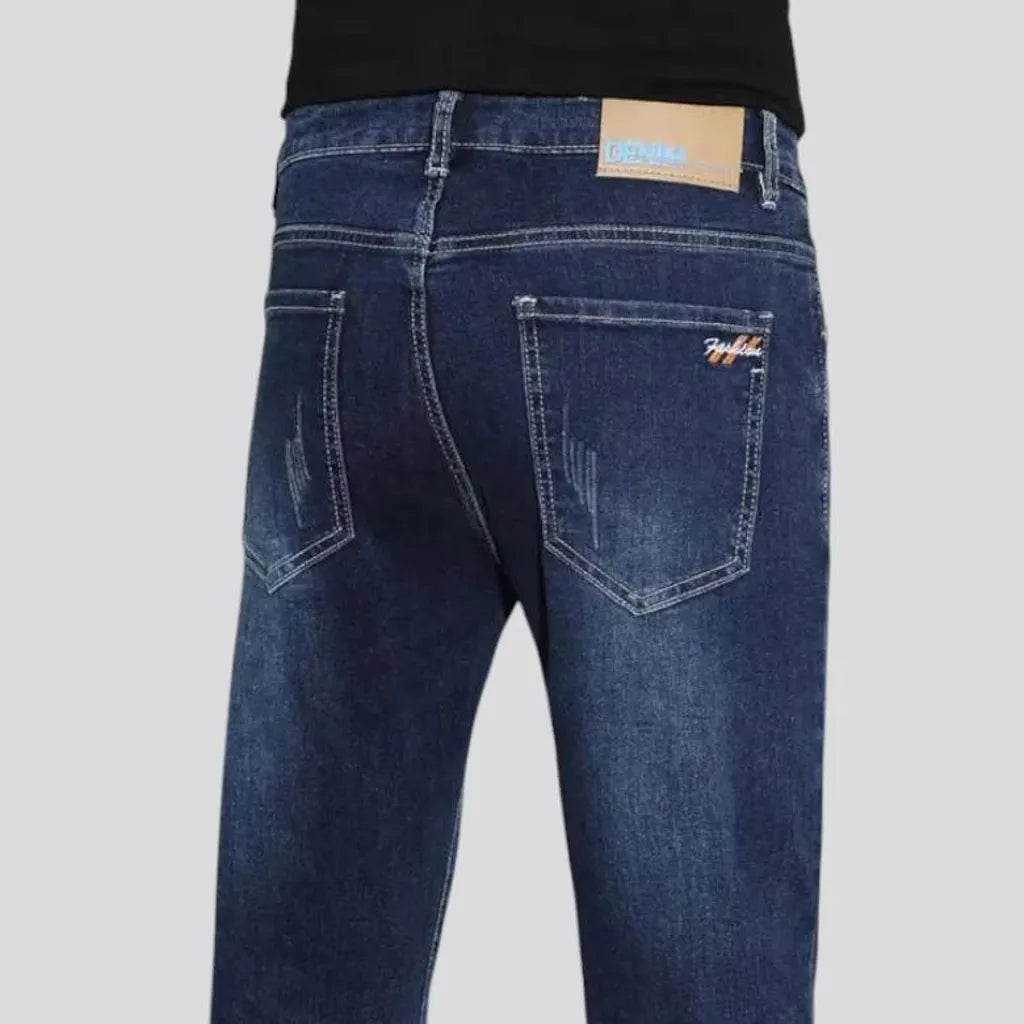 Dark slim-fitting casual men's jeans