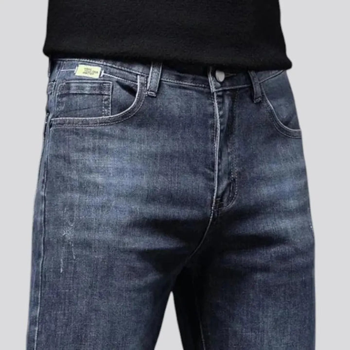 Elastic dark padded jeans for men