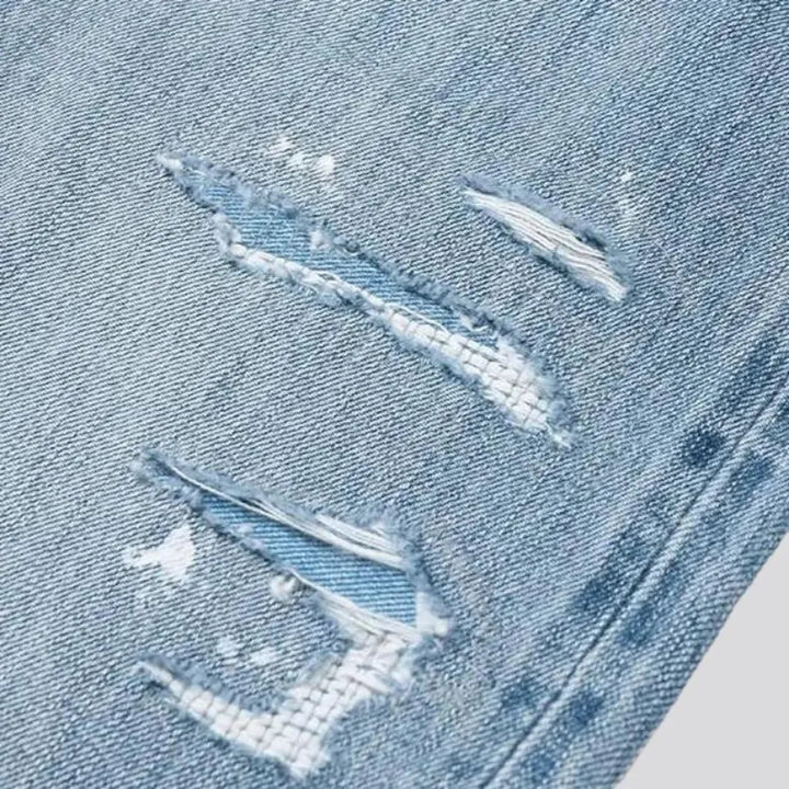 Distressed men's self-edge jeans