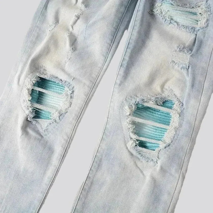 Grunge men's light-wash jeans