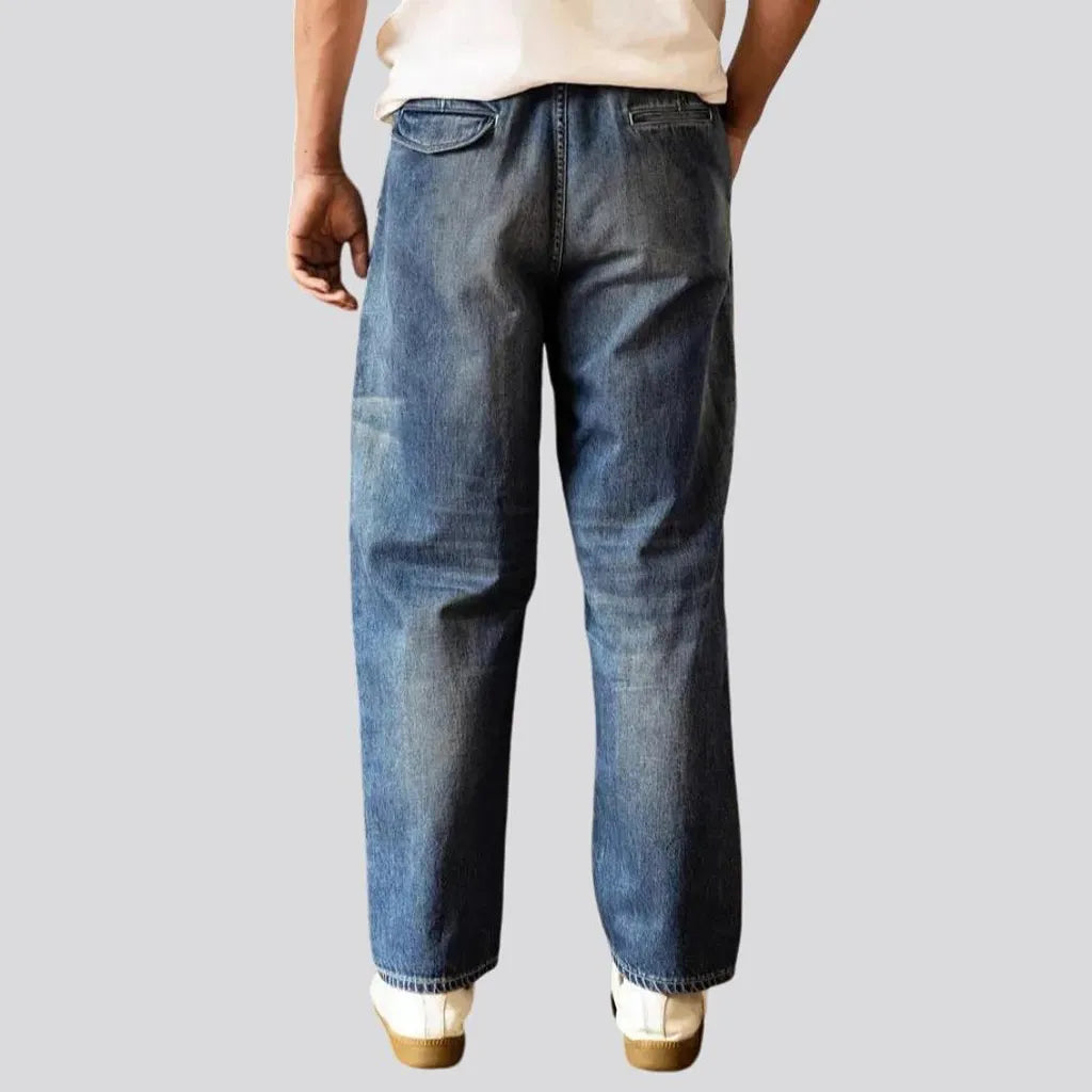 Whiskered medium wash baggy men's jeans