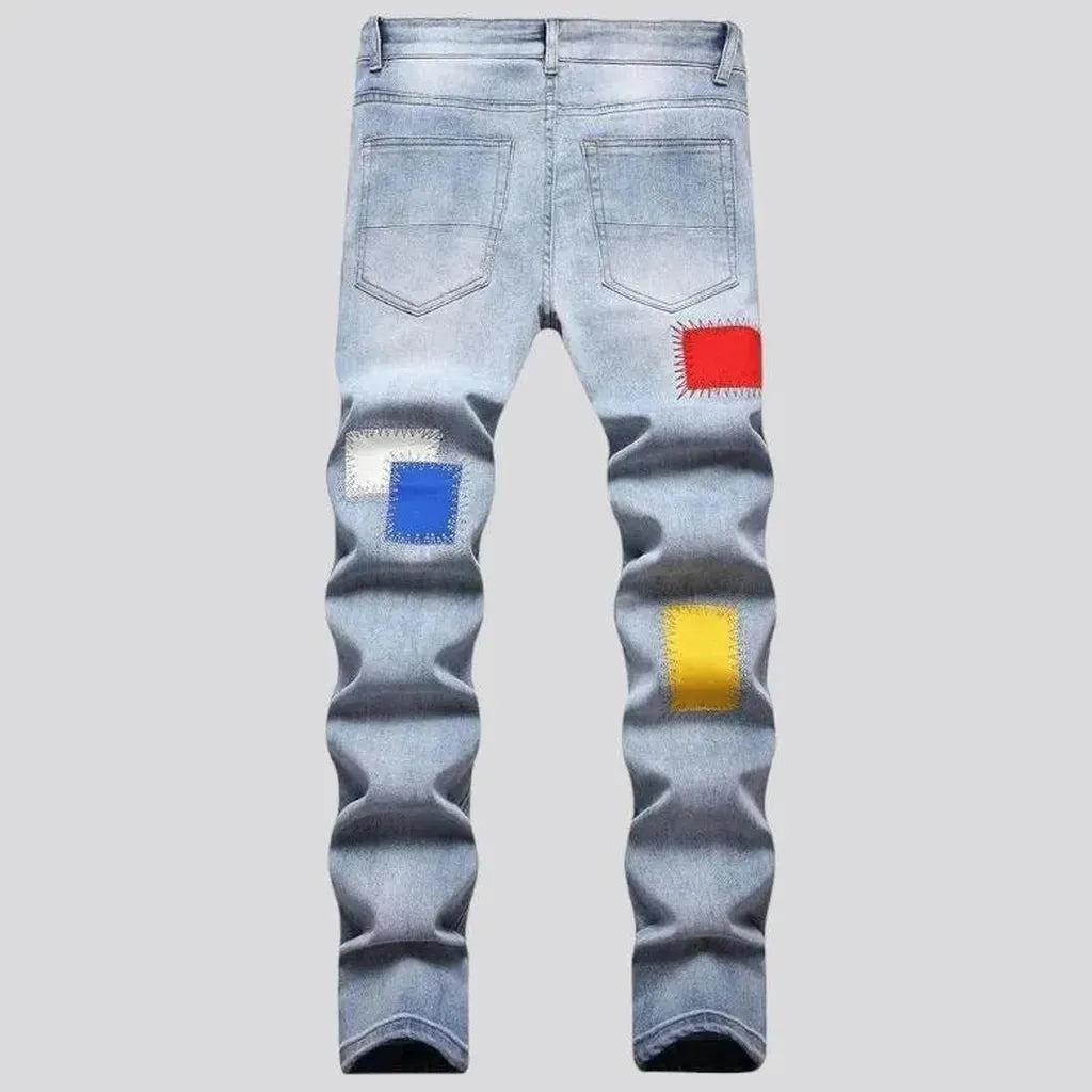 Light-wash color-patches jeans