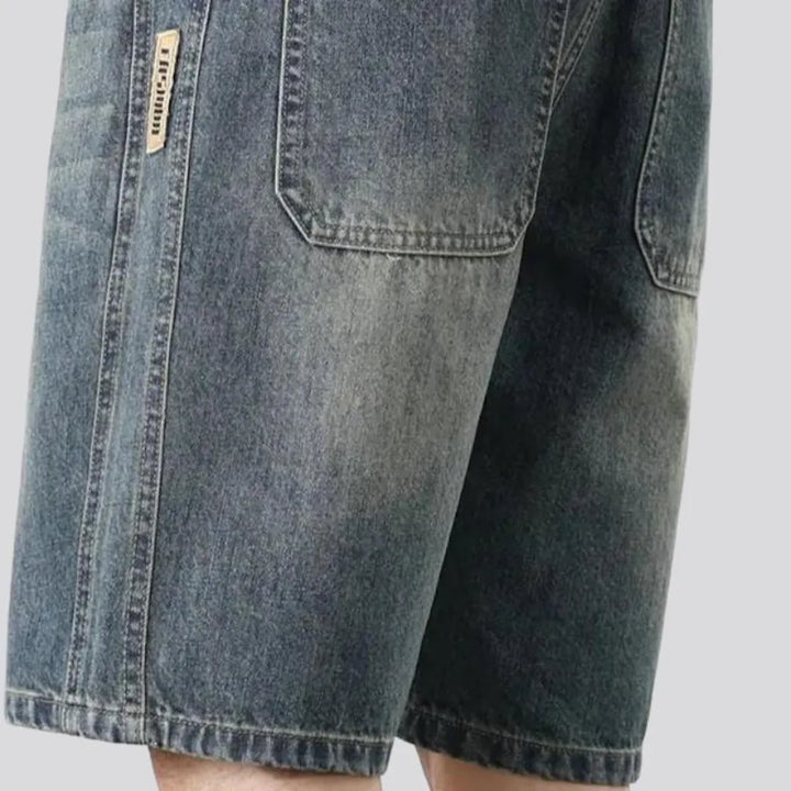 Sanded knee-length jeans shorts