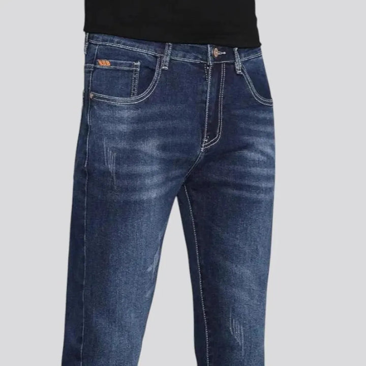 Dark slim-fitting casual men's jeans