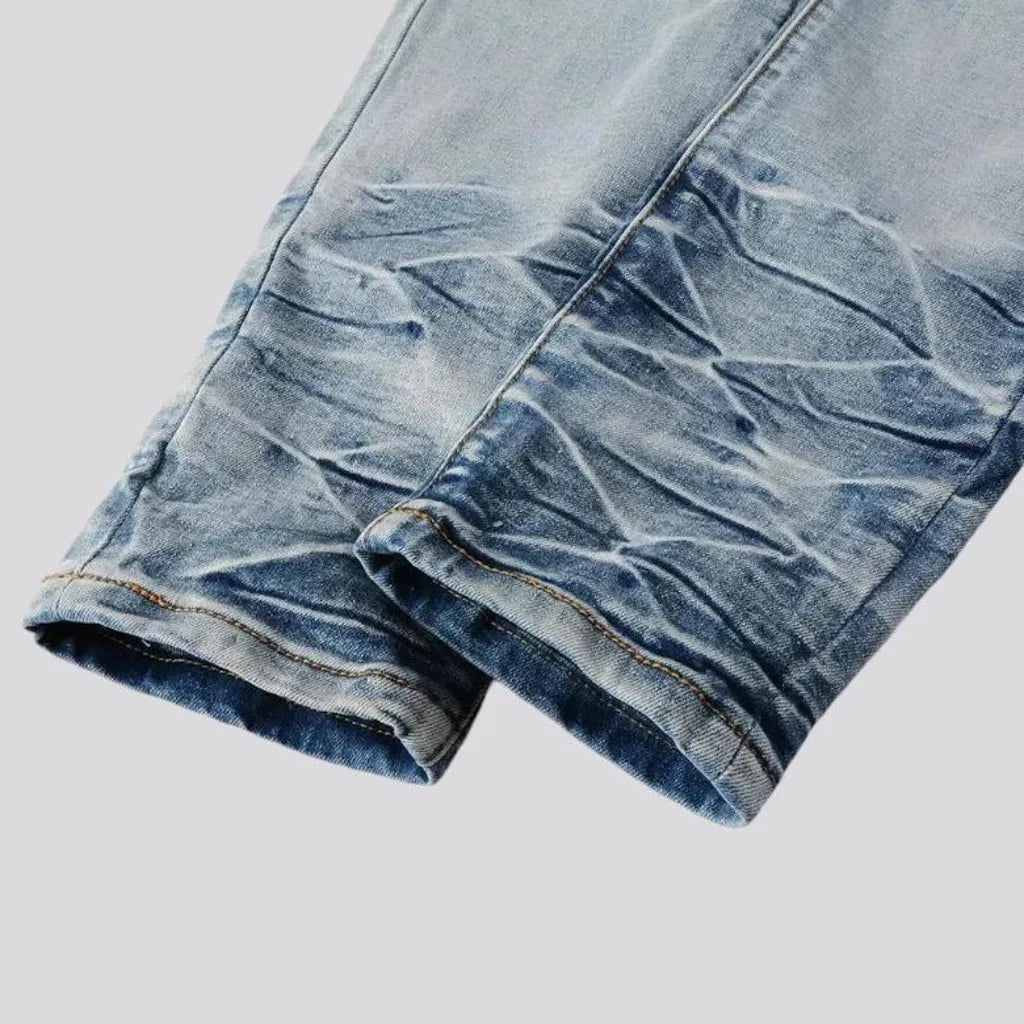 Distressed vintage mid-rise riding men's jeans