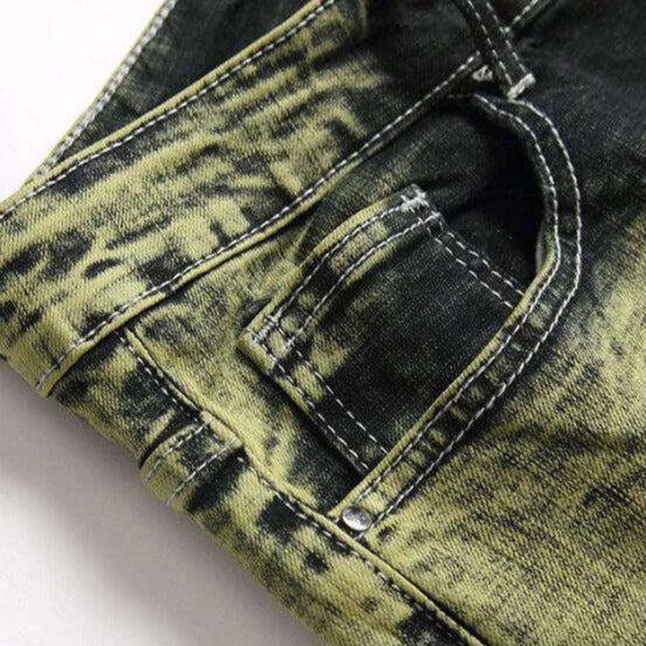 Green over-dyed distressed jeans